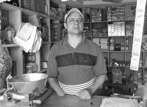 A man with physical disability who is busy in his shop