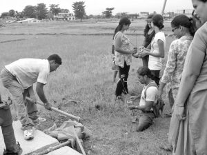 Group of persons with disabilities are working in the farm