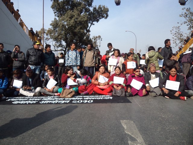 People with disabiltiies sitting on the road protesting