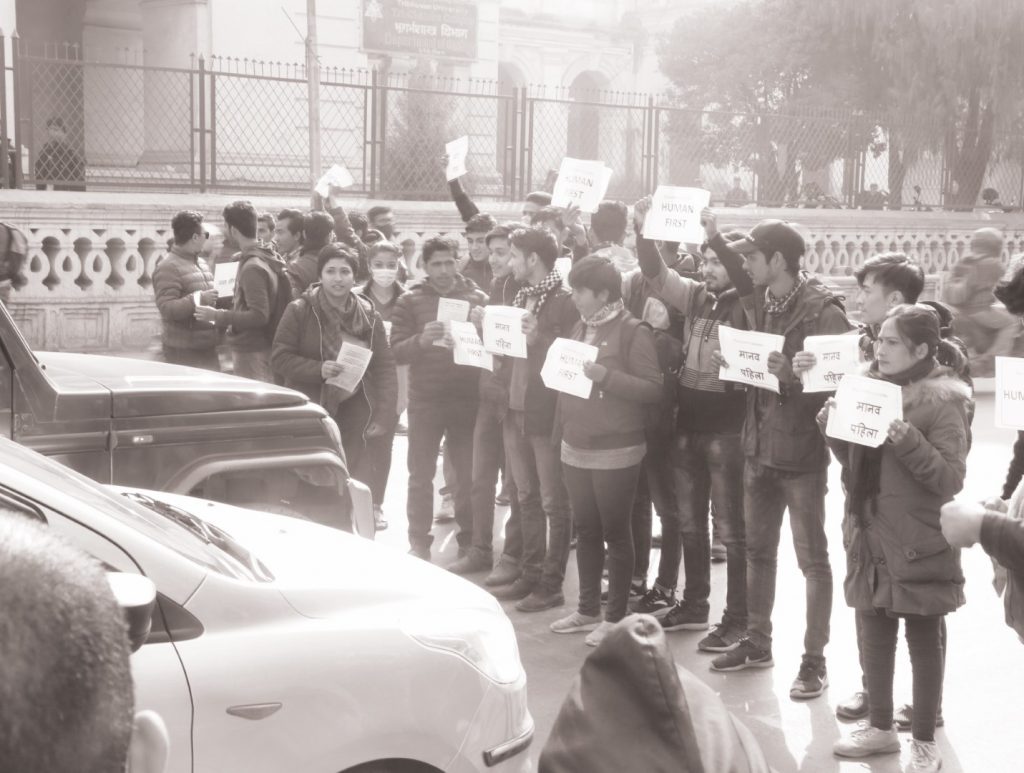 Human First Campaigners advocating for safety using plac cards