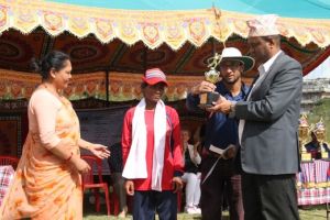 sudershan subedi chairperson of NFDN giving the troffi in 1st international blind women cricket tour