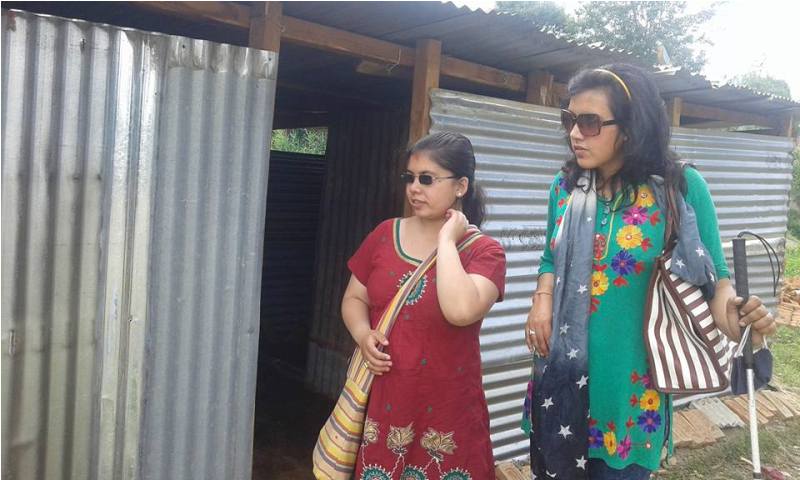 Sarita Lamichhane distributing releif