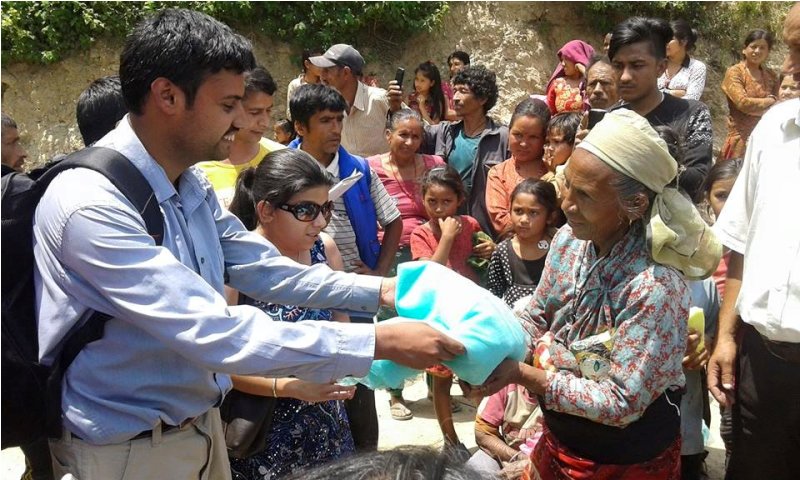 Sushil Adhikari distributing releif