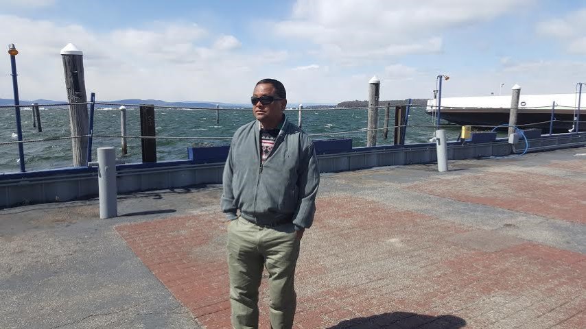 Writing taking  photograph infront of a sea