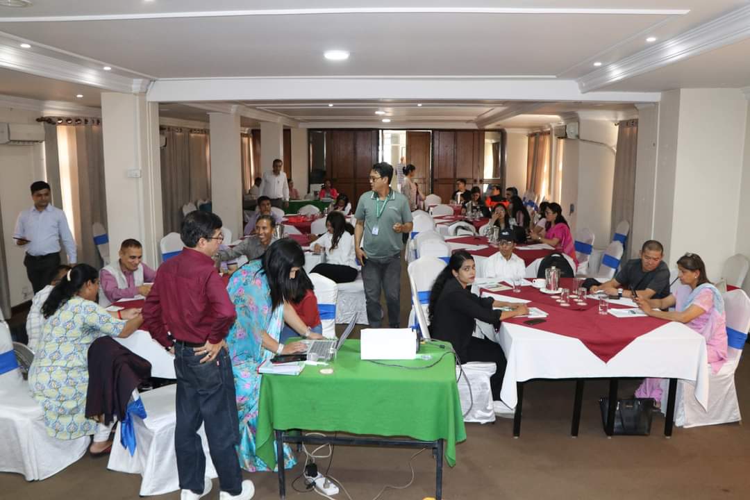 workshop participants busy in discussion in meeting hall