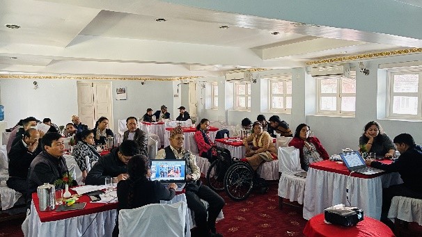 a photo of workshop participant listening