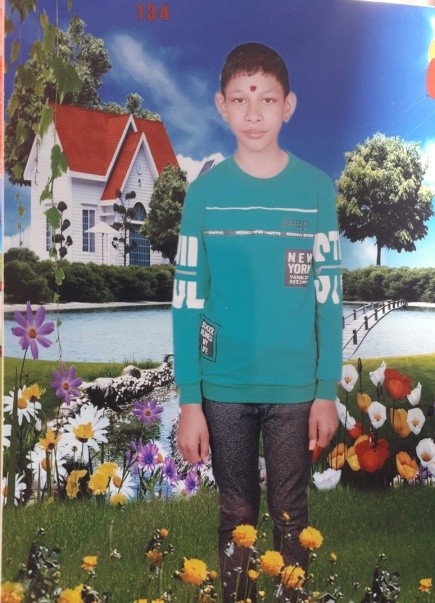 Boy standing at photo studio