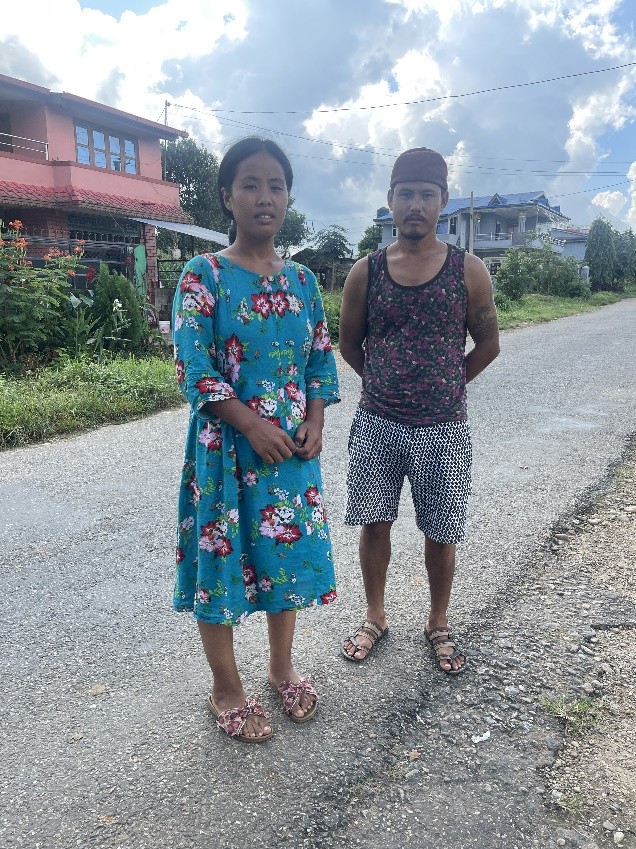 Man and women are standing on road side