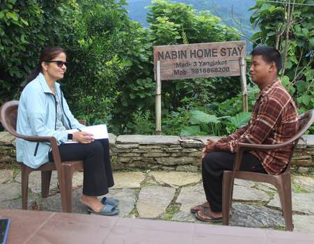 to persons one lady sitting another make sitting and doing interview